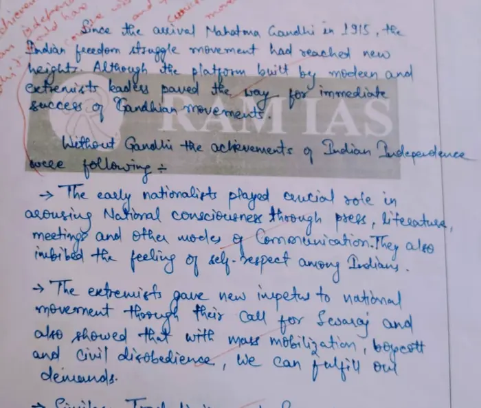 A handwritten answer copy checked in red ink, with corrections written along the margin