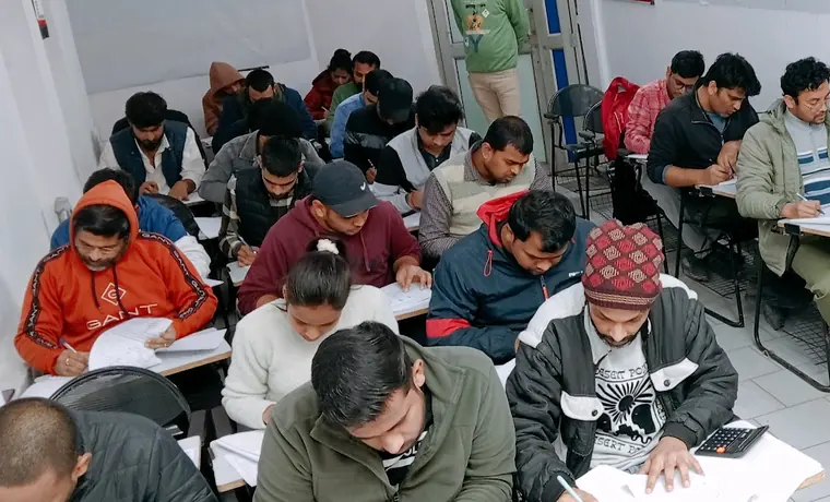 A full class at Ram IAS Academy writing at their desks